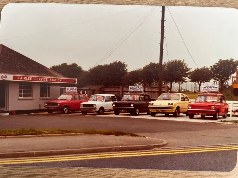 A row of cars for sale outside the Fairlee Service Station shop in its early days